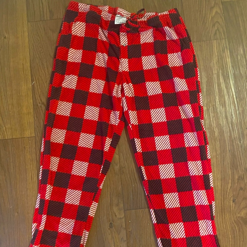 Two men’s pajama pants for lounging around the house. 1 red and 1 blue plaid.